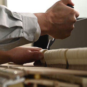 picture of a piano action being voiced